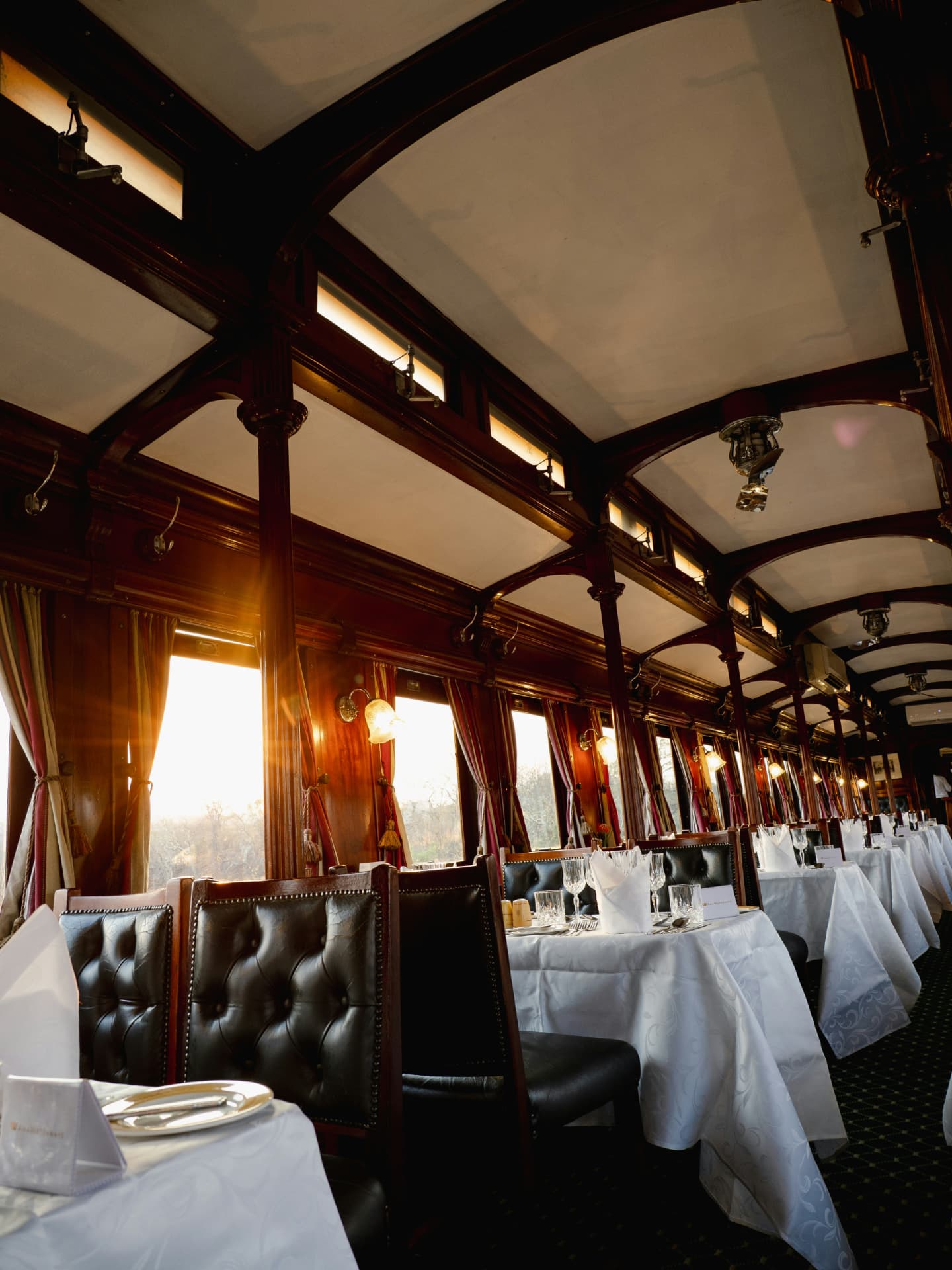 Vintage train dining car in golden light
